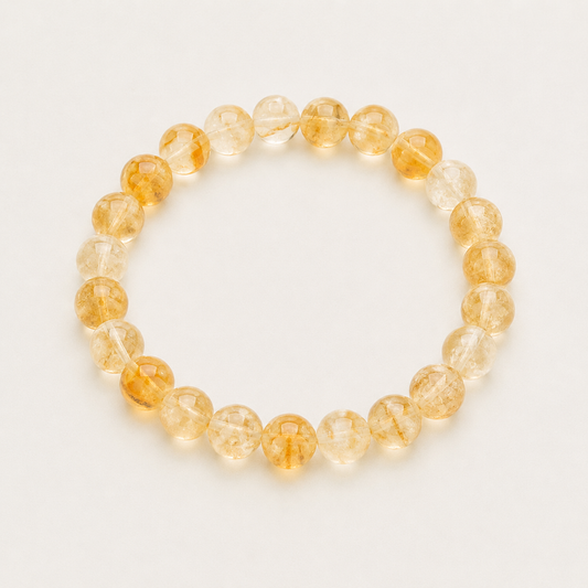 Citrine Beaded bracelet with yellow and orange beads on a light background