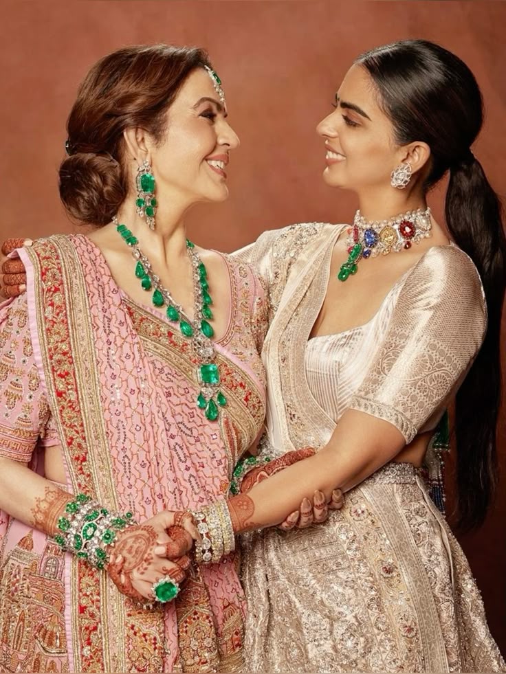 Nita Ambani and daughter Isha Ambani wearing family jewels