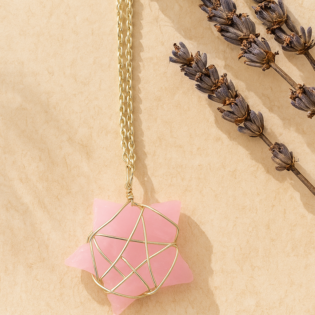 Necklace with pink pendant and gold chain on beige background with lavender flowers
