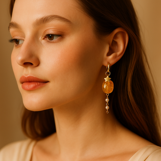 Close-up of a woman wearing elegant earrings with a soft background