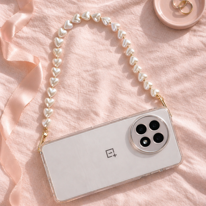 Smartphone with a pearl strap on a pink fabric background