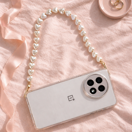 Smartphone with a pearl strap on a pink fabric background