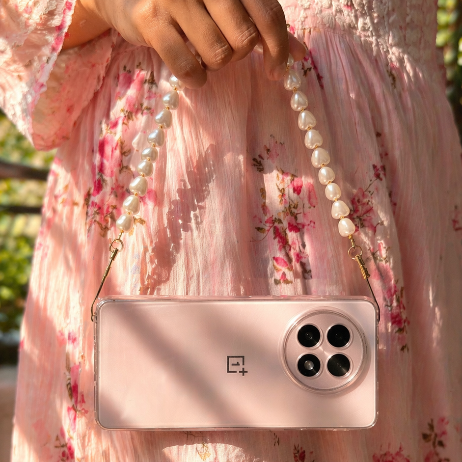 Person holding a pink phone case with a floral dress